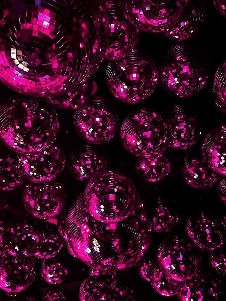 pexels-photo-28944778-28944778 Glamorous disco balls in pink create a dazzling atmosphere for any nightlife event.
